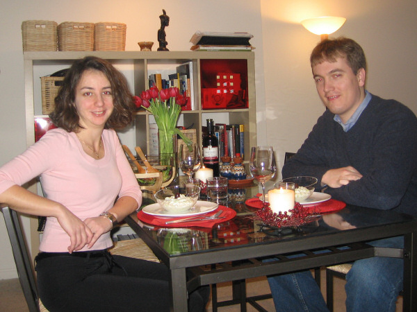 At the table.