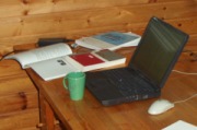 Research tools: books, laptop, coffee.